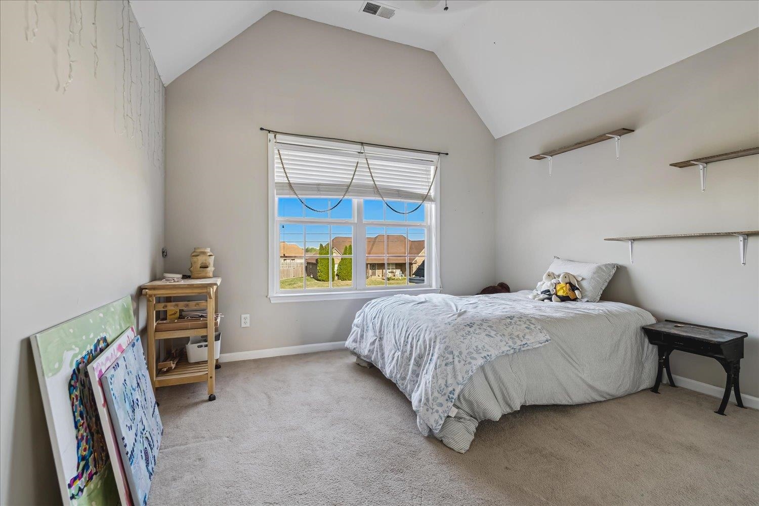 134 Rembert Drive Atoka, TN 38004 - Photo 19 of 28 a bed sitting in a bedroom next to a window