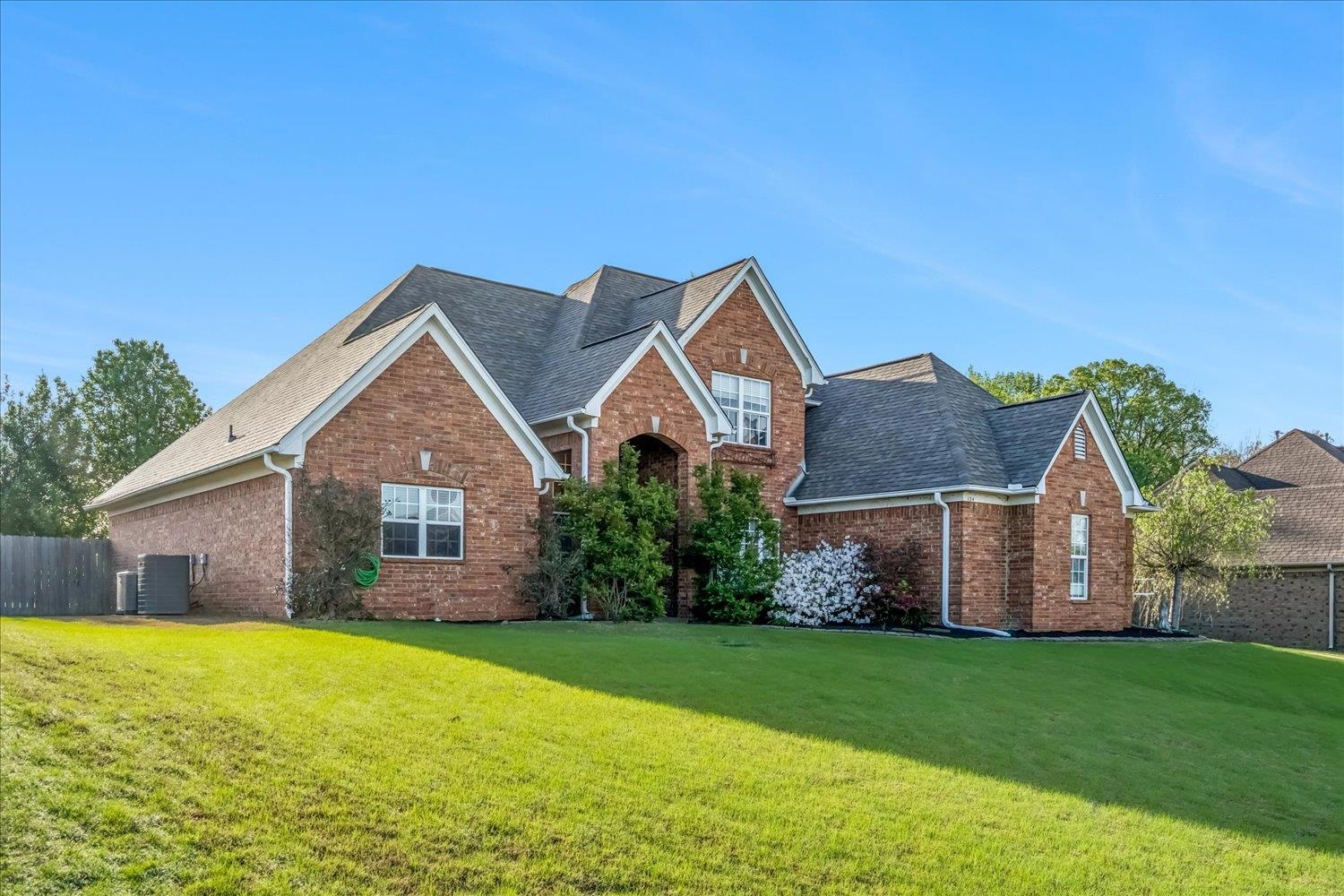 134 Rembert Drive Atoka, TN 38004 - Photo 2 of 28 a front view of house with yard and green space