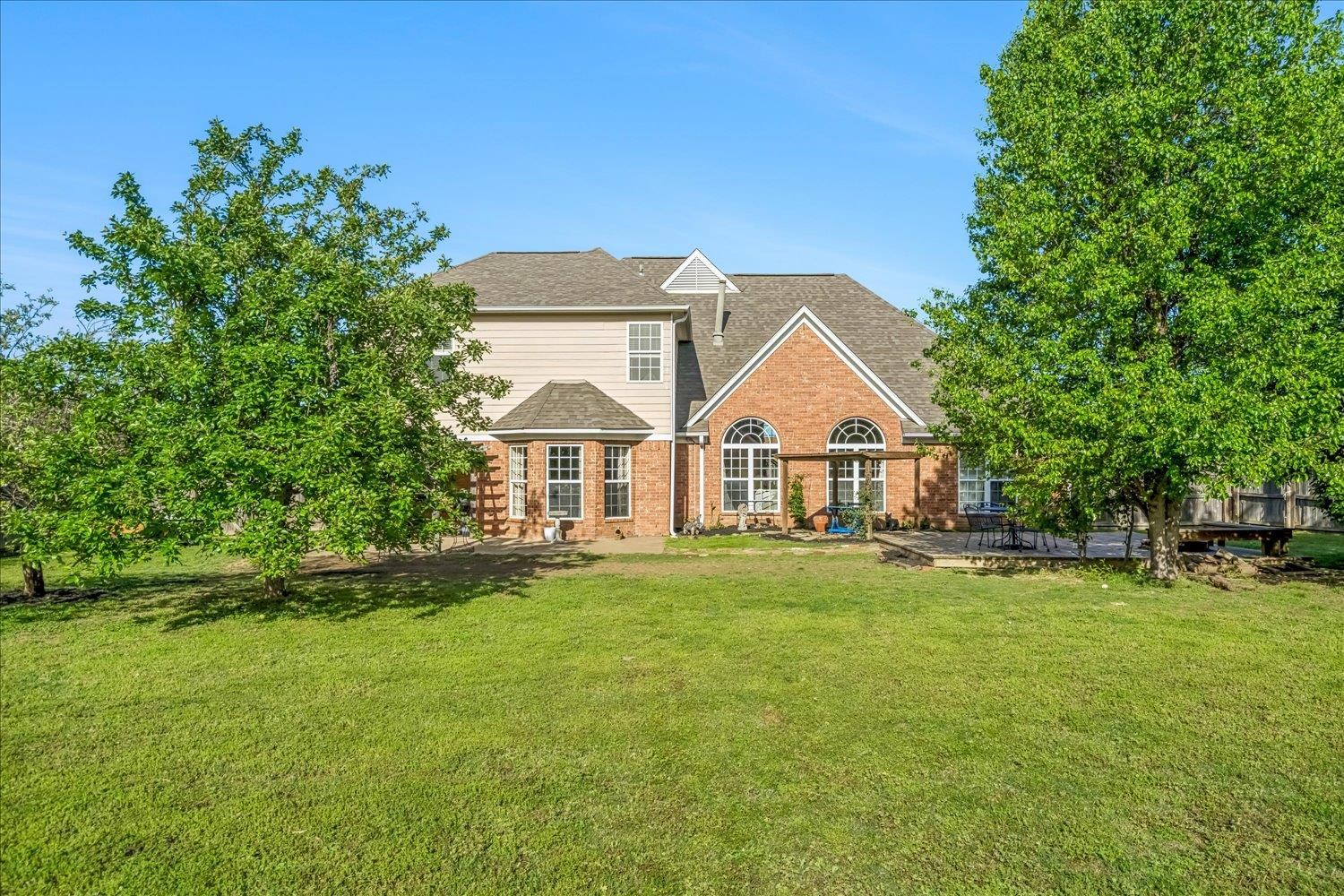 134 Rembert Drive Atoka, TN 38004 - Photo 26 of 28 a view of a house with a yard