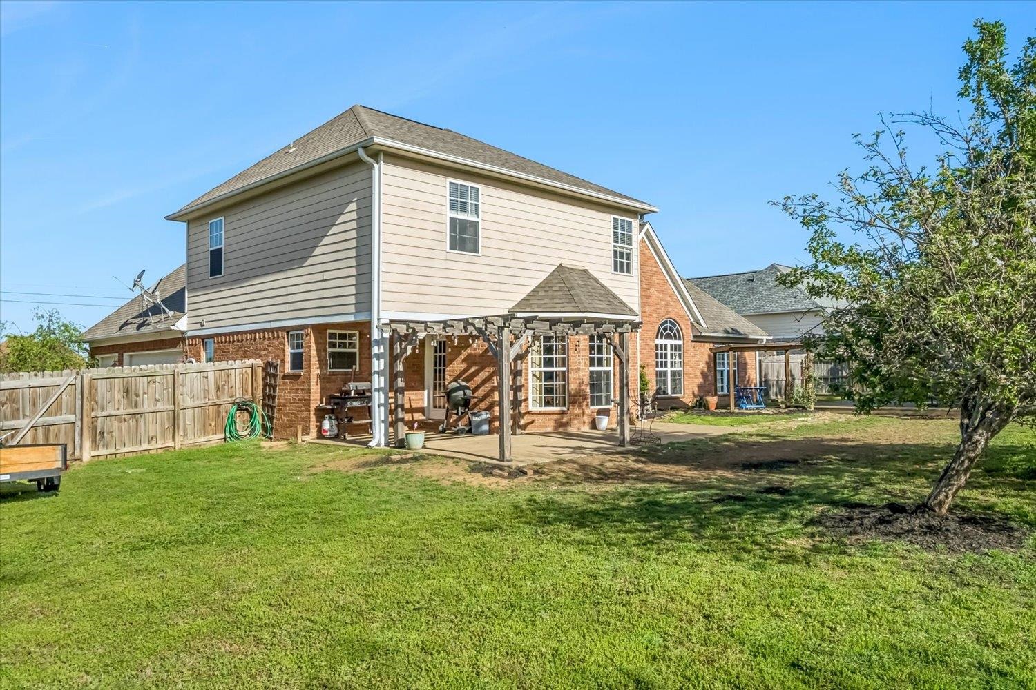 134 Rembert Drive Atoka, TN 38004 - Photo 27 of 28 a view of a house with a yard