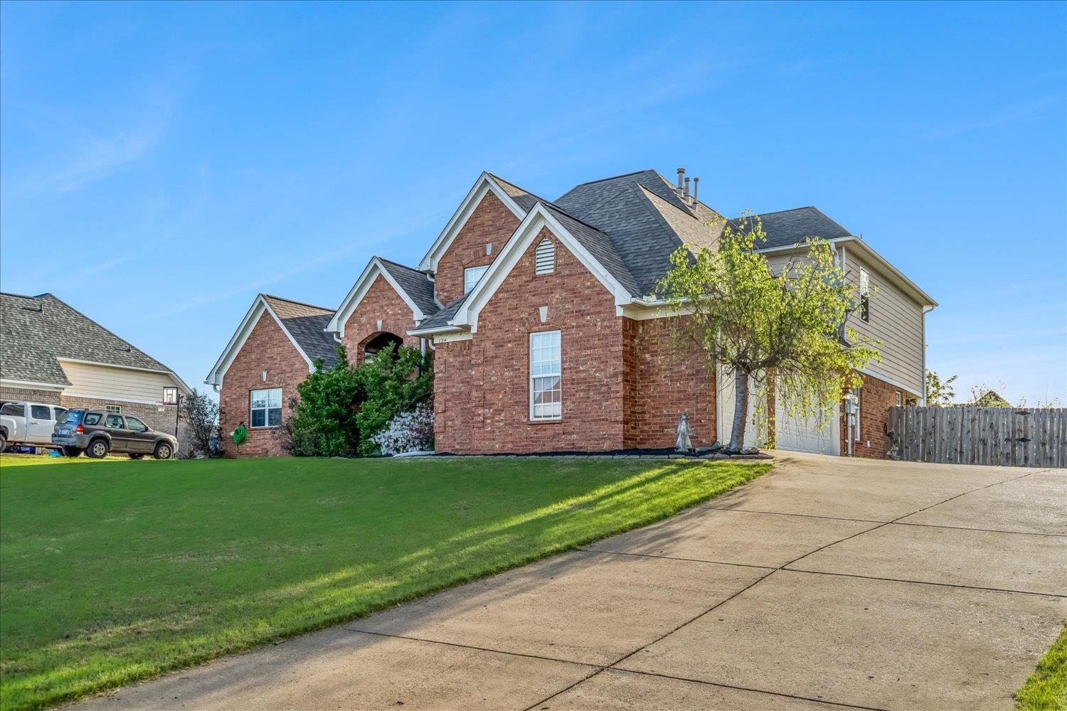 134 Rembert Drive Atoka, TN 38004 - Photo 3 of 28 a front view of a house with a yard and garage
