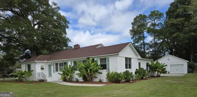 a front view of a house with garden