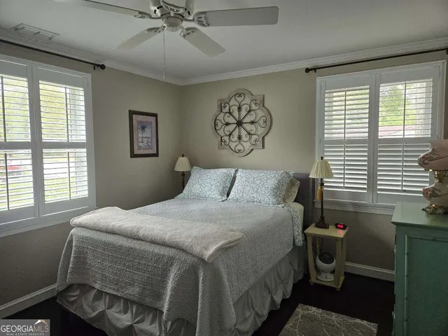 a bathroom with a toilet and a mirror