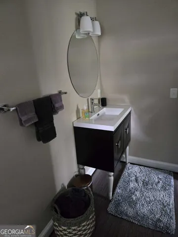 a living room with furniture wooden floor and a window