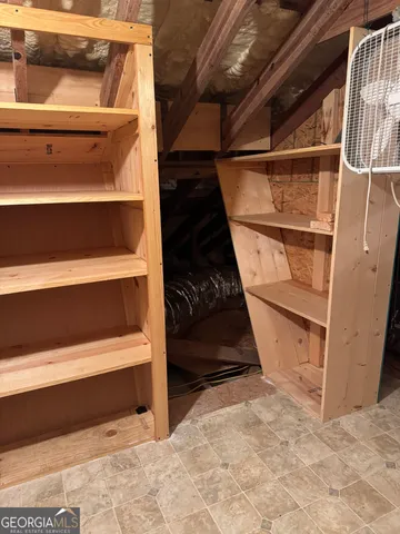 a view of house with backyard and deck