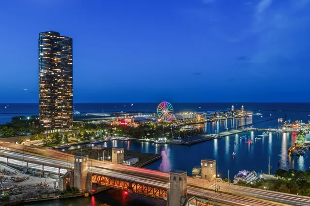 a view of a balcony with dining table and chairs