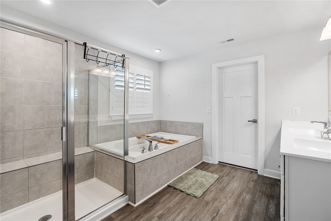 216 Bronson Ridge Anderson, SC 29621 - Photo 27 of 45 Luxurious bathing quarters with a deep soaking tub and a spacious glass-enclosed shower.