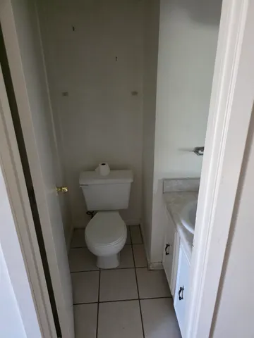 a bathroom with a toilet and a sink