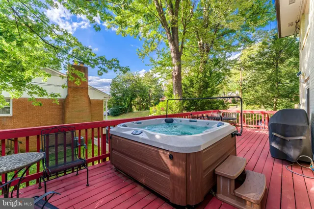 a view of a balcony with two chairs and a potted plant