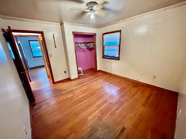 wooden floor in a hall with an entryway
