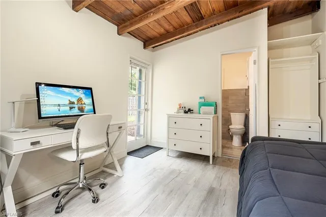 a front view of a house with a yard and fountain