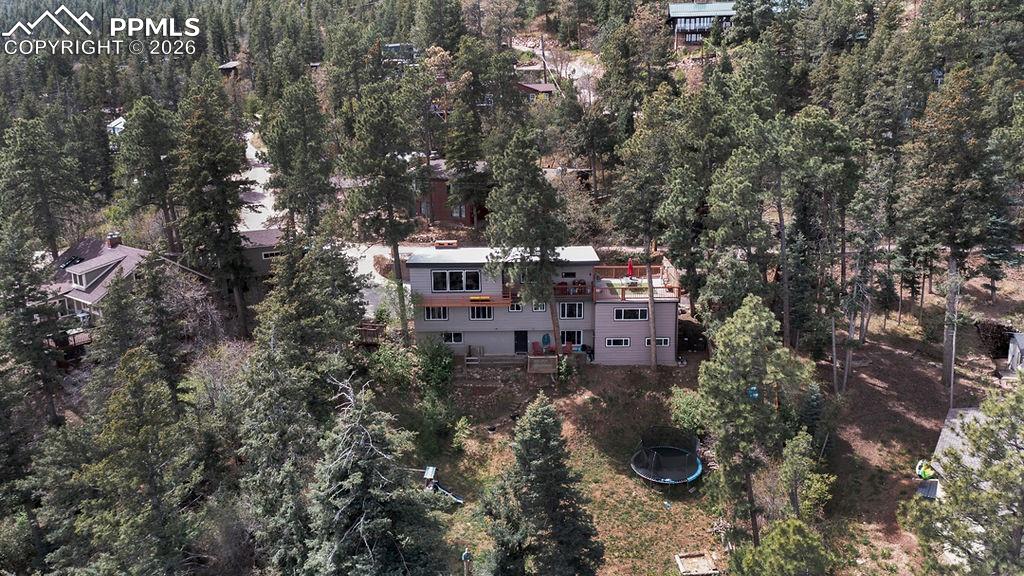3785 Overlook Road Colorado Springs, CO 80906 - Photo 42 of 45 a view of a house with a yard