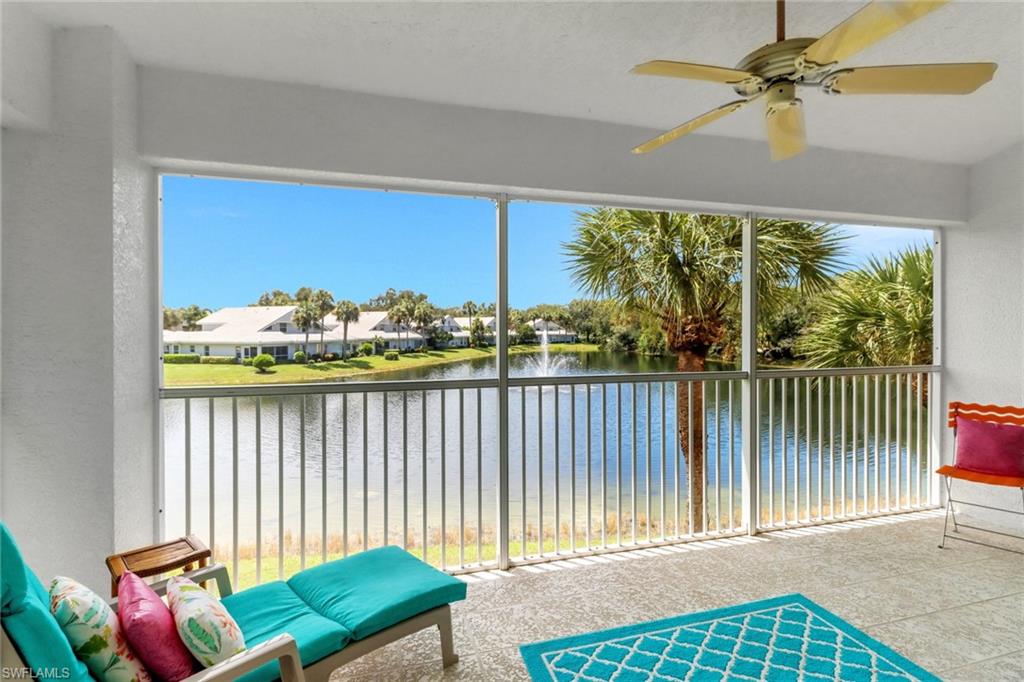 6180 Reserve Circle, Unit 203 Naples, FL 34119 - Photo 1 of 26 Large lanai with view of lake and fountain