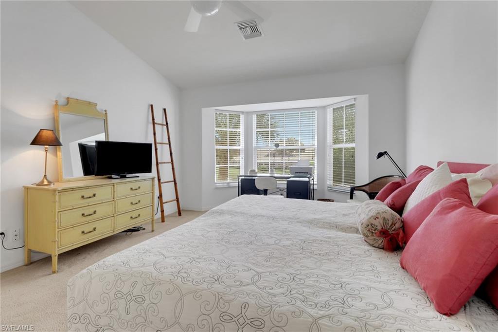 6180 Reserve Circle, Unit 203 Naples, FL 34119 - Photo 11 of 26 Primary bedroom with front and center views of lake/fountain