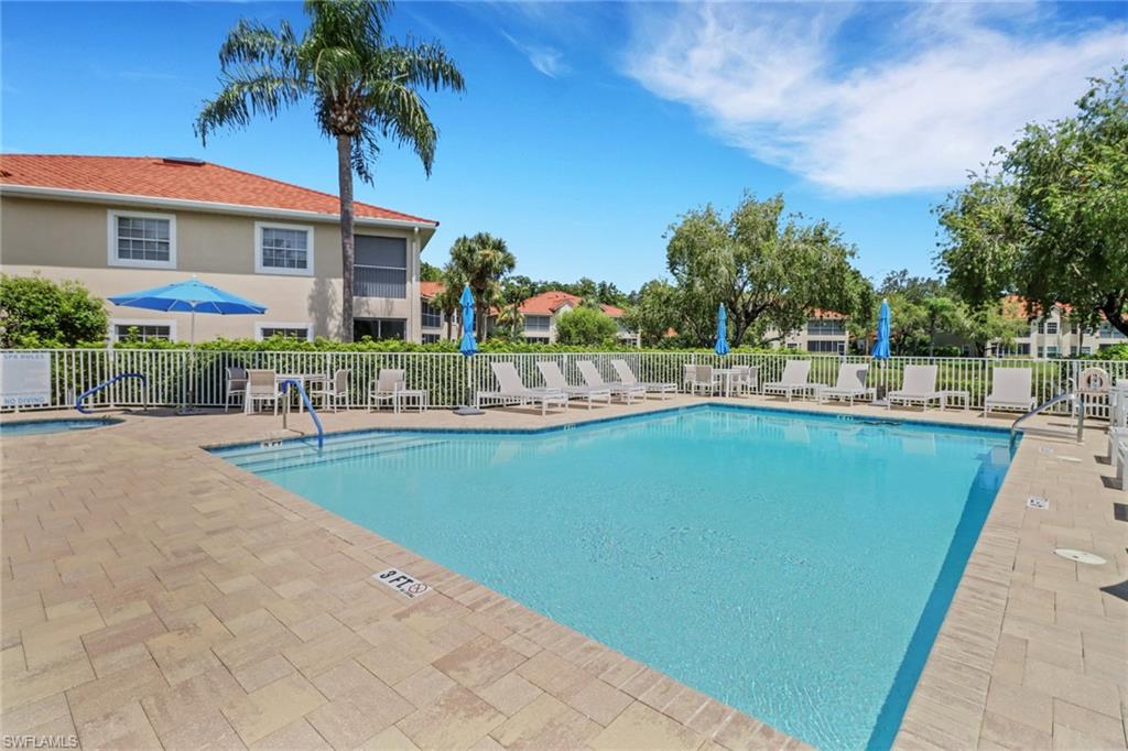6180 Reserve Circle, Unit 203 Naples, FL 34119 - Photo 26 of 26 Community pool with hot tub