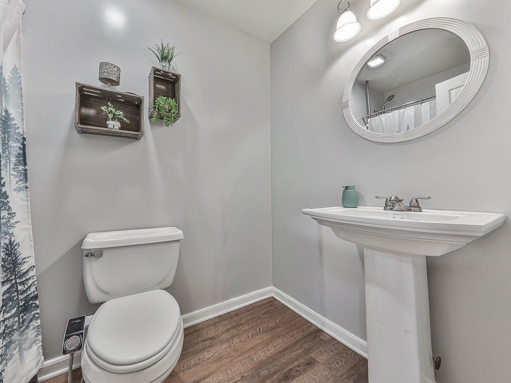 68 Arbor Hills Road South Talking Rock, GA 30175 - Photo 11 of 36 a bathroom with a toilet sink and mirror