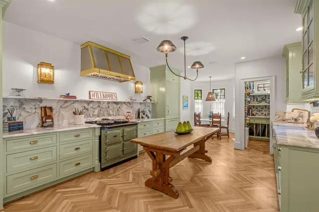 a kitchen with a cabinets and living room