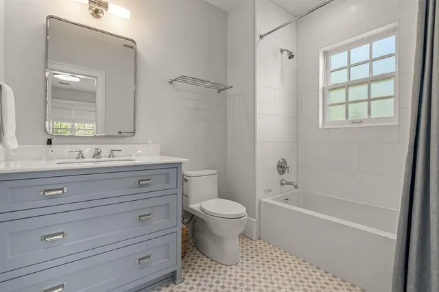 a bathroom with a sink a toilet and a bathtub