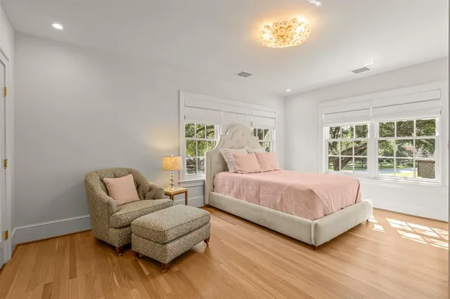 a bedroom with a bed and a couch