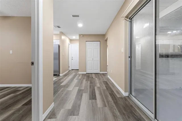 a view of a bathroom from a hallway