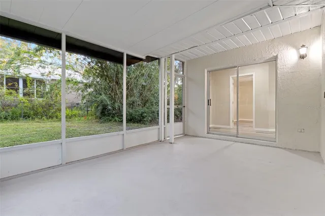 a view of an empty room with a large window