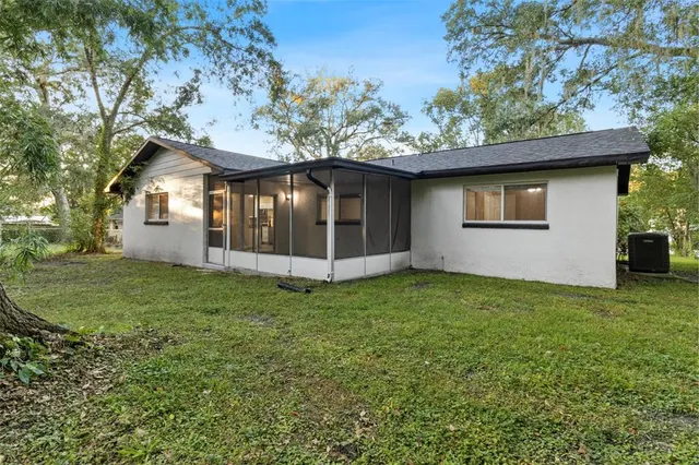 a house with a tree in front of it