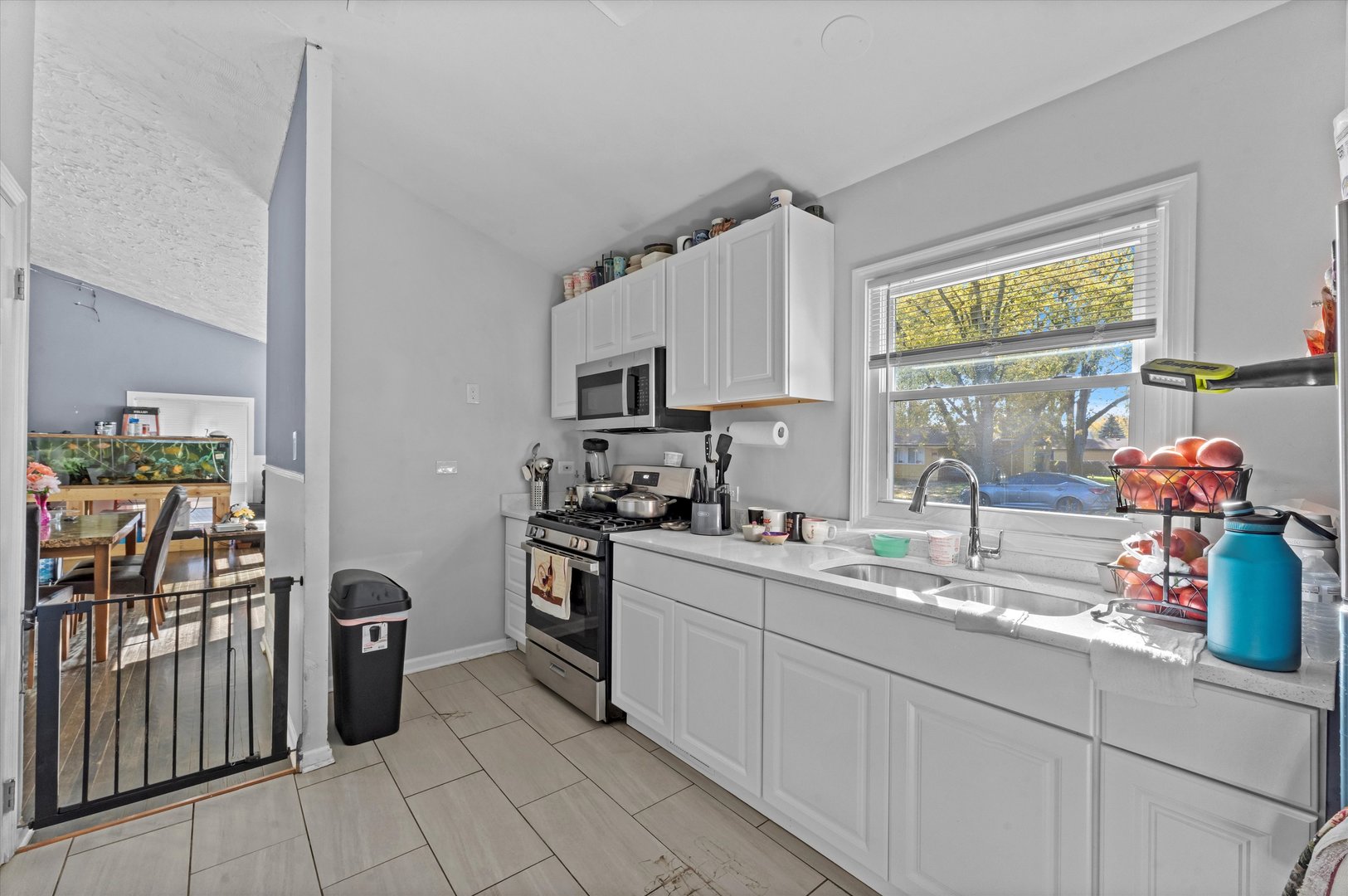 3334 Heather Drive Markham, IL 60428 - Photo 5 of 12 a kitchen with stainless steel appliances granite countertop a sink stove and refrigerator