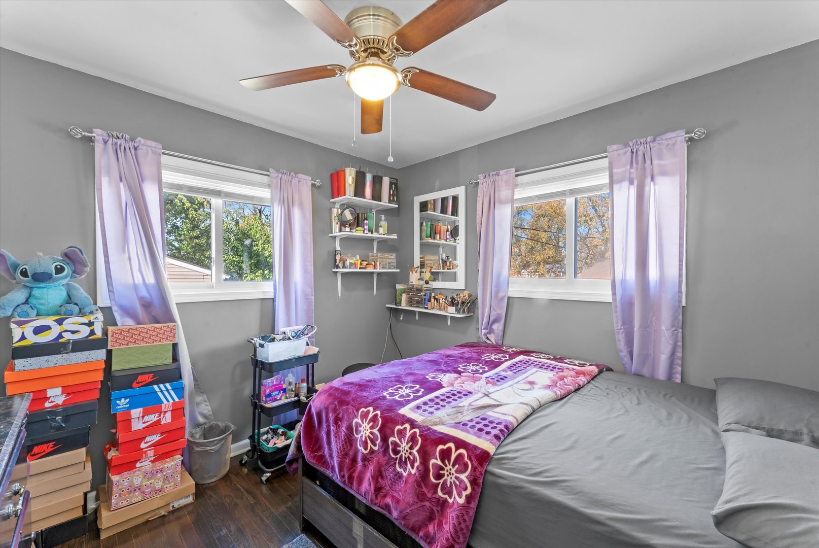 3334 Heather Drive Markham, IL 60428 - Photo 6 of 12 a bedroom with a bed a dresser and a chandelier