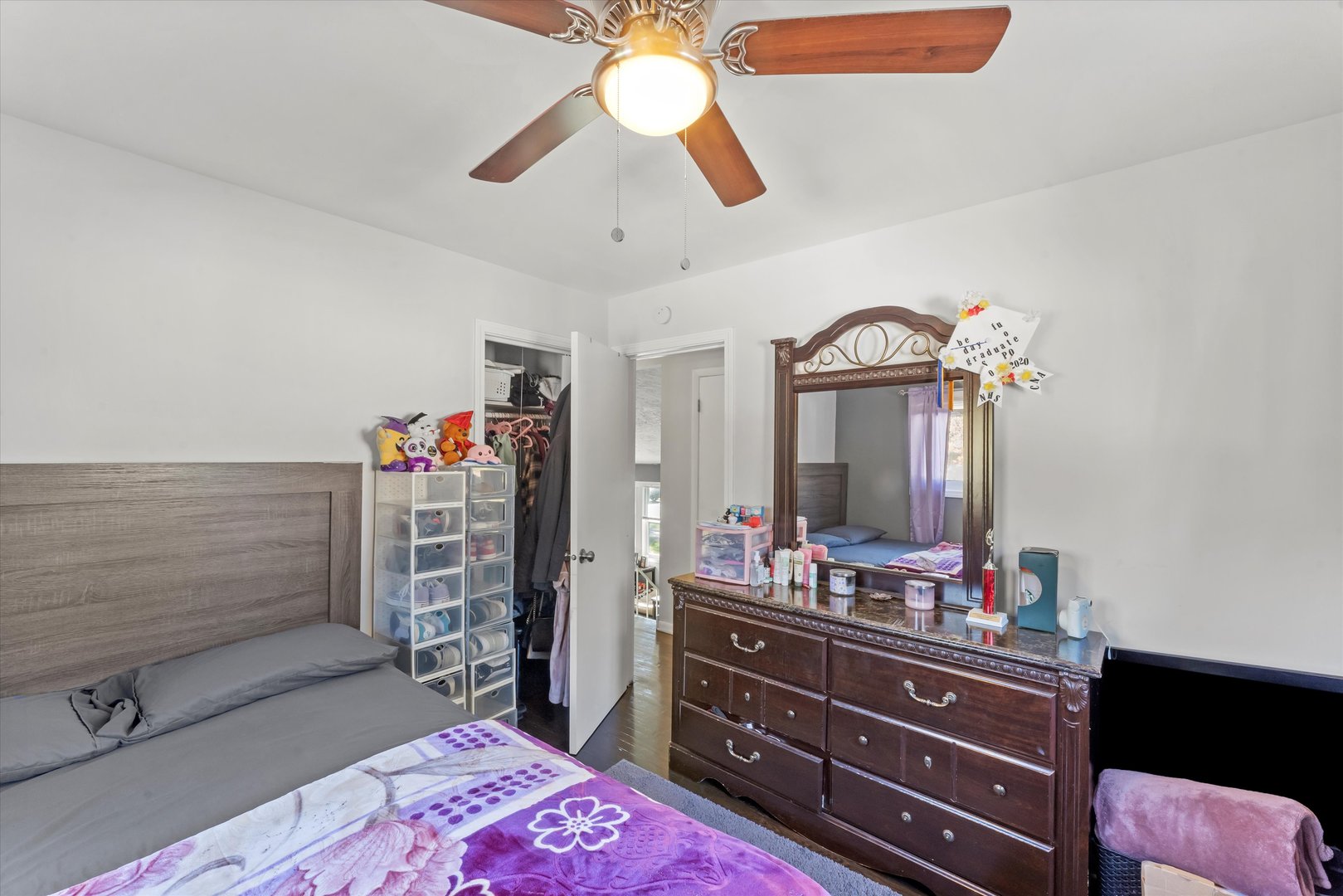 3334 Heather Drive Markham, IL 60428 - Photo 7 of 12 a bedroom with a bed and a mirror on dresser