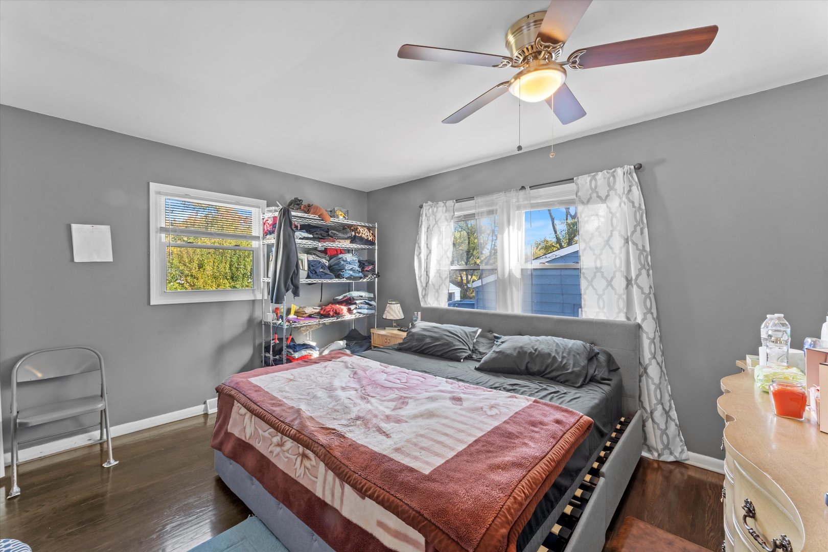 3334 Heather Drive Markham, IL 60428 - Photo 9 of 12 a bed room with a bed and a chandelier