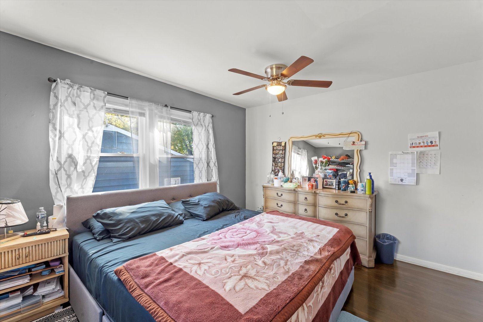 3334 Heather Drive Markham, IL 60428 - Photo 10 of 12 a bedroom with a bed a chandelier and a window