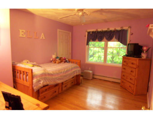111 Leigh Road Cumberland, RI 02864 - Photo 8 of 9 a bedroom with a bed and a dresser
