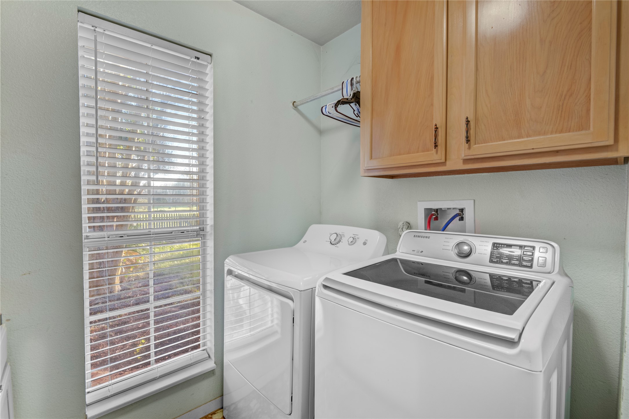 21503 Pecan Bend Road Damon, TX 77430 - Photo 19 of 39 a utility room with dryer and washer