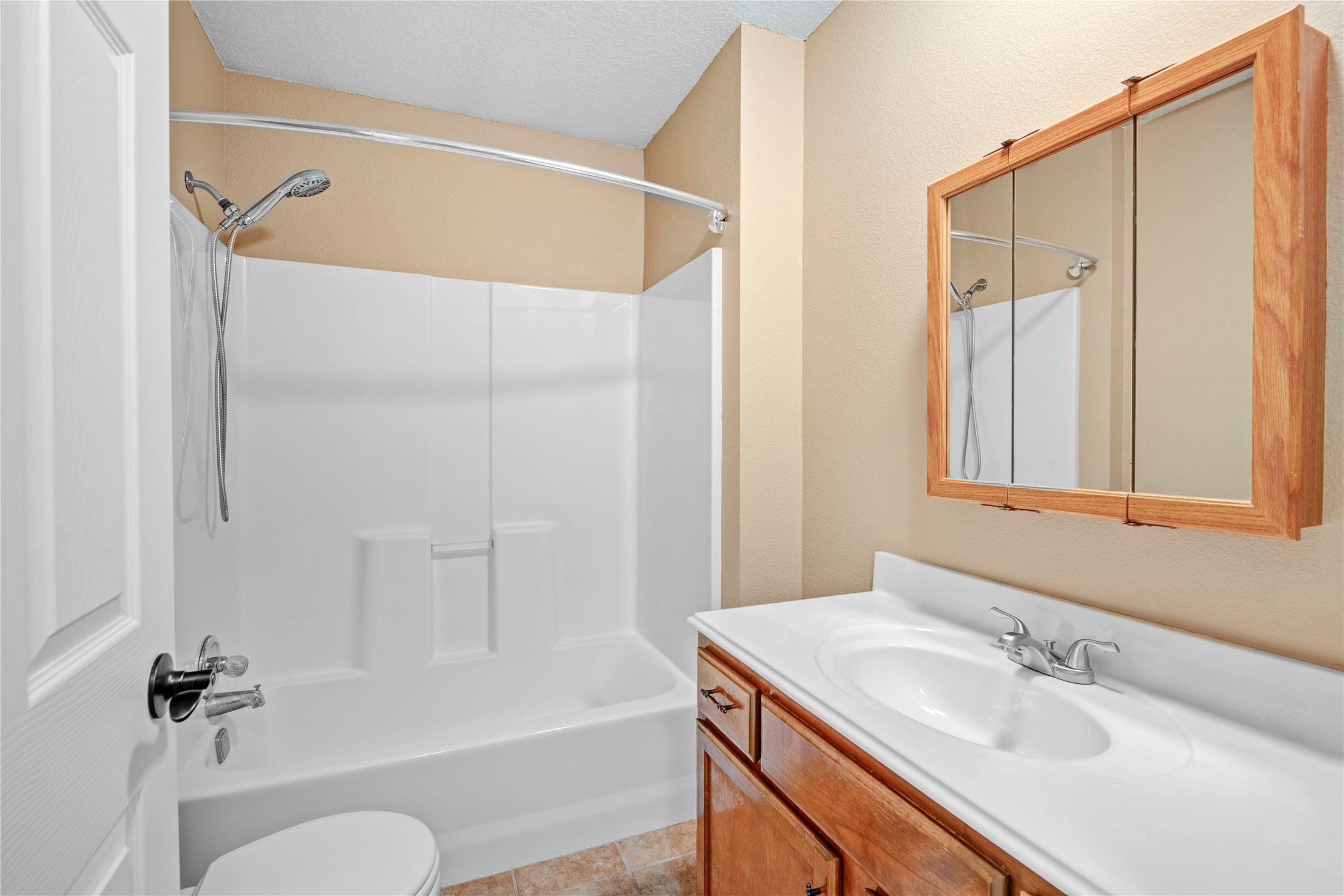 21503 Pecan Bend Road Damon, TX 77430 - Photo 31 of 39 a bathroom with a granite countertop sink toilet and shower