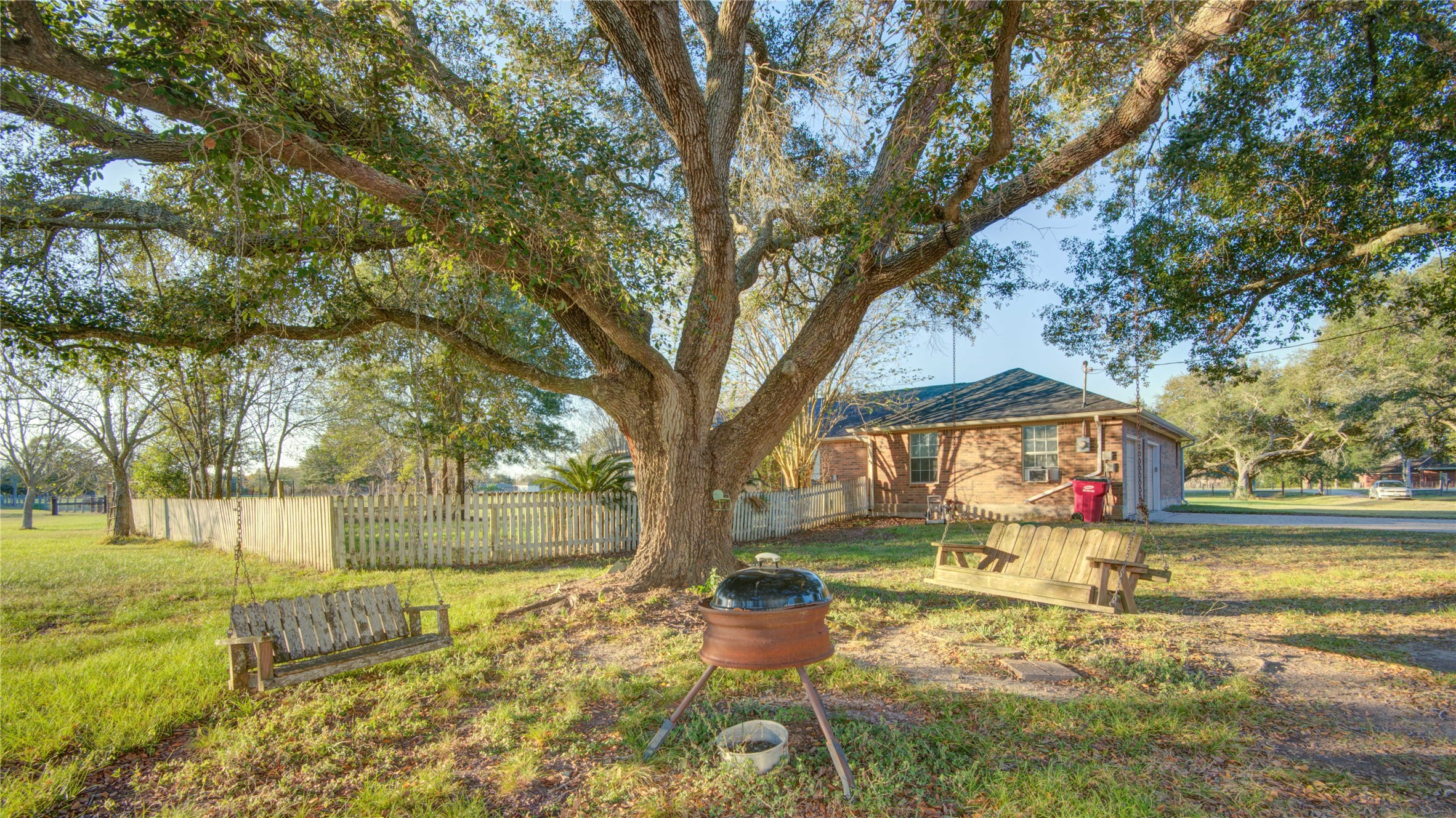 21503 Pecan Bend Road Damon, TX 77430 - Photo 38 of 39 a front view of a house with a yard fountain and a tree