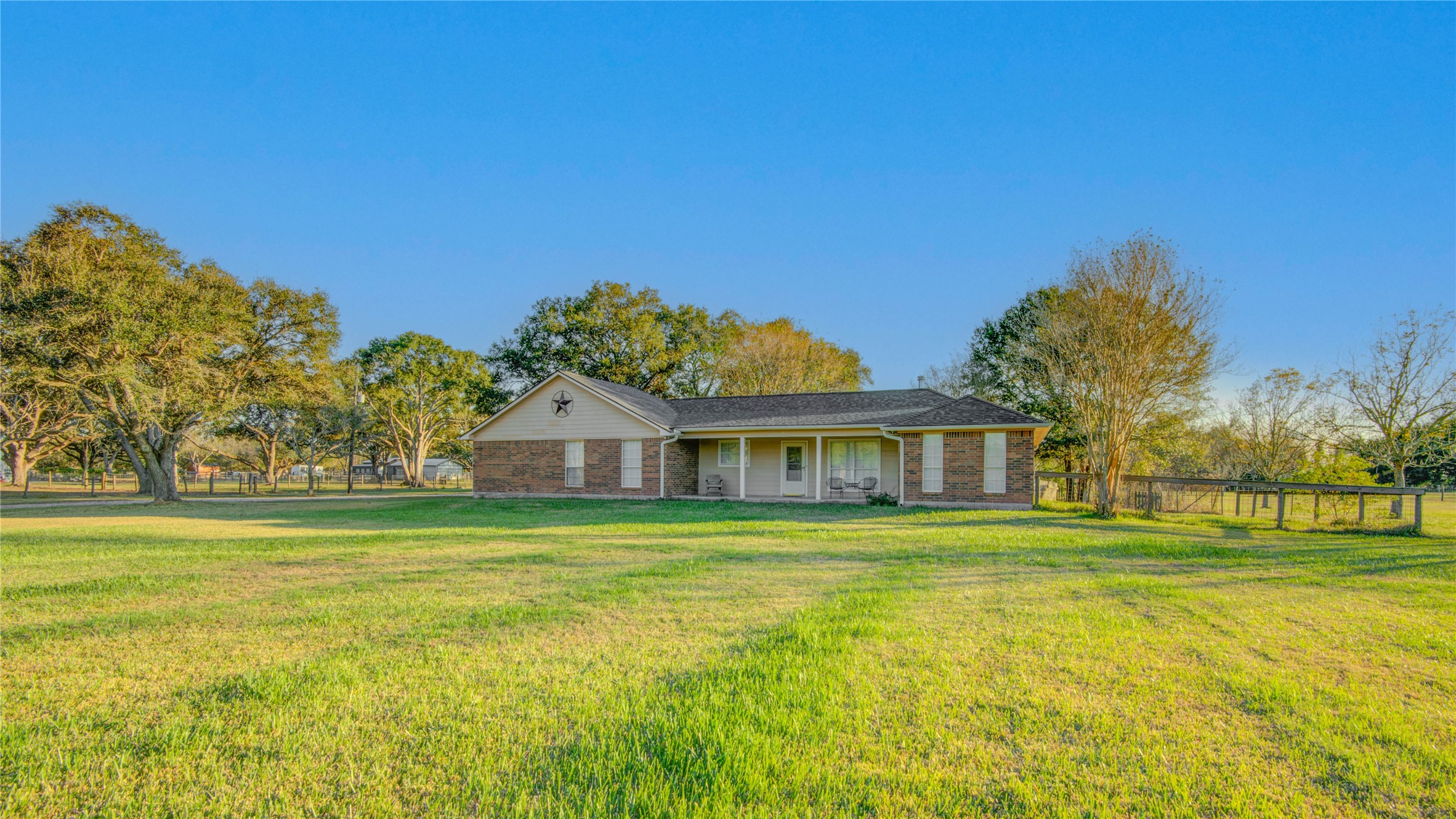 21503 Pecan Bend Road Damon, TX 77430 - Photo 4 of 39 a front view of a house with a big yard