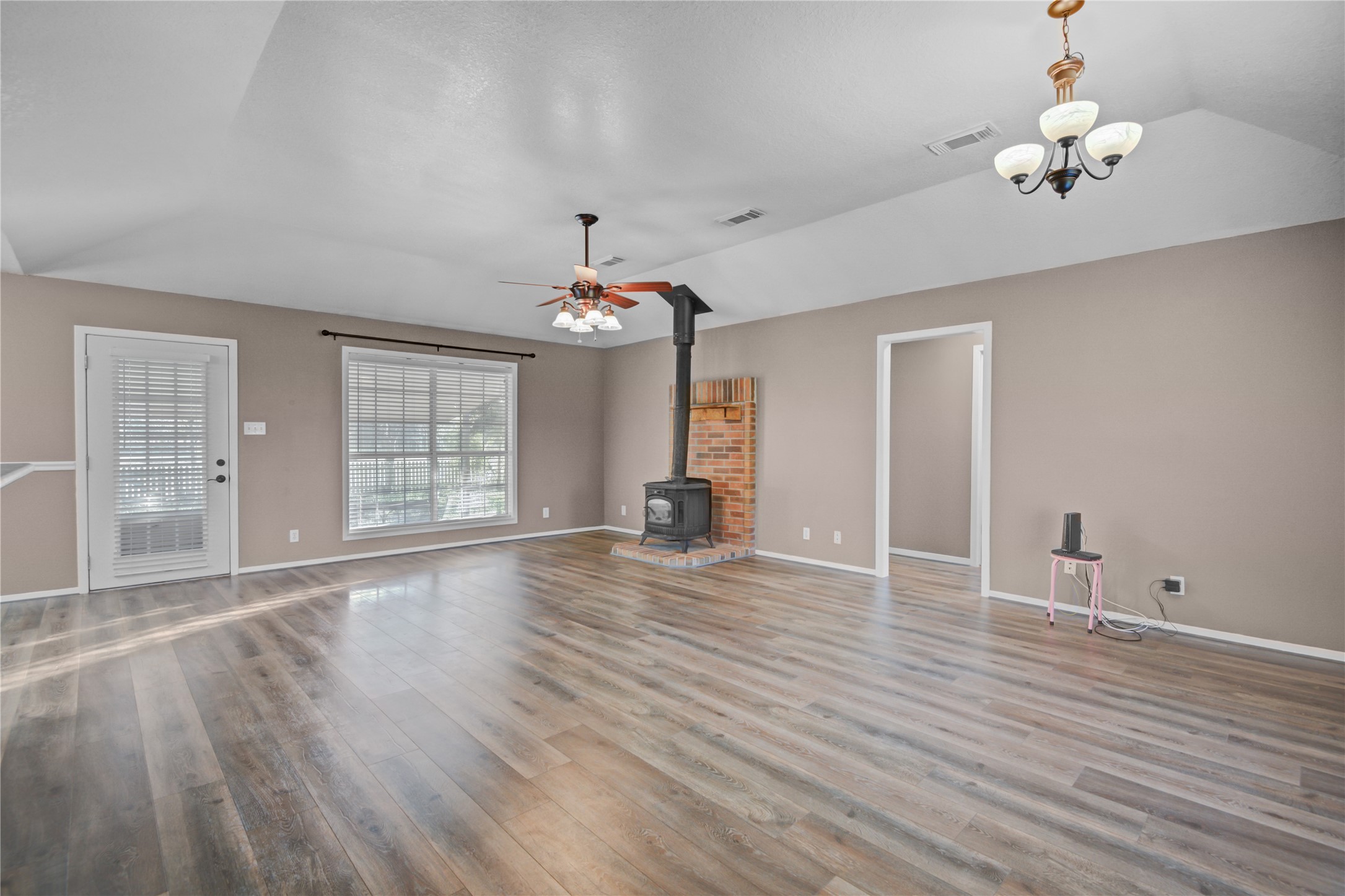 21503 Pecan Bend Road Damon, TX 77430 - Photo 8 of 39 a view of an empty room with wooden floor and a window