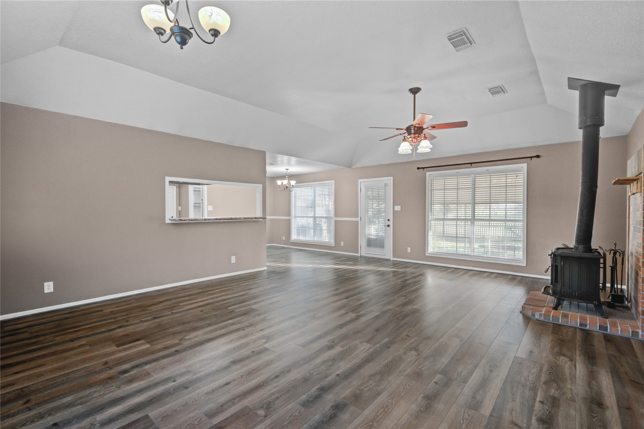 21503 Pecan Bend Road Damon, TX 77430 - Photo 9 of 39 a view of empty room with wooden floor and fan