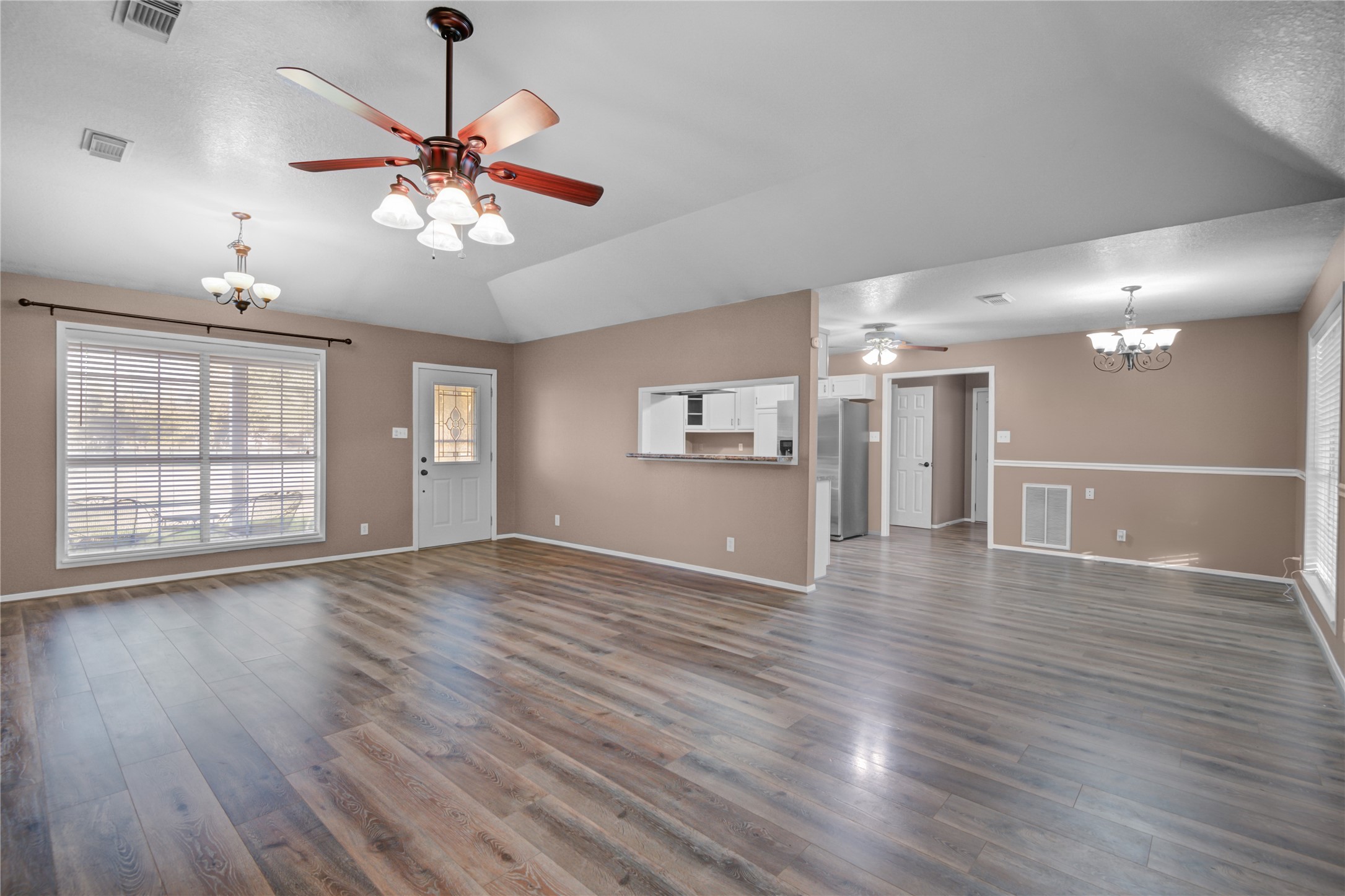 21503 Pecan Bend Road Damon, TX 77430 - Photo 10 of 39 a view of an empty room with wooden floor and a window
