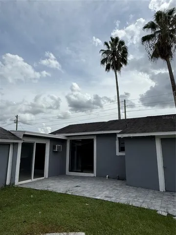 a view of house with yard and entertaining space