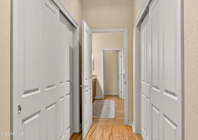 a bathroom with a granite countertop sink a mirror and a shower
