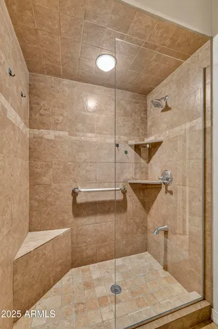 a bathroom with a sink vanity and toilet