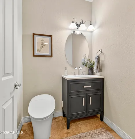 a view of a hallway with wooden floor and workspace
