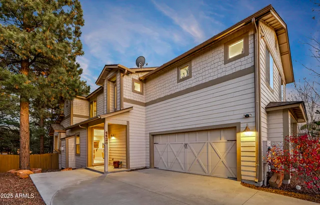 a front view of a house with parking area