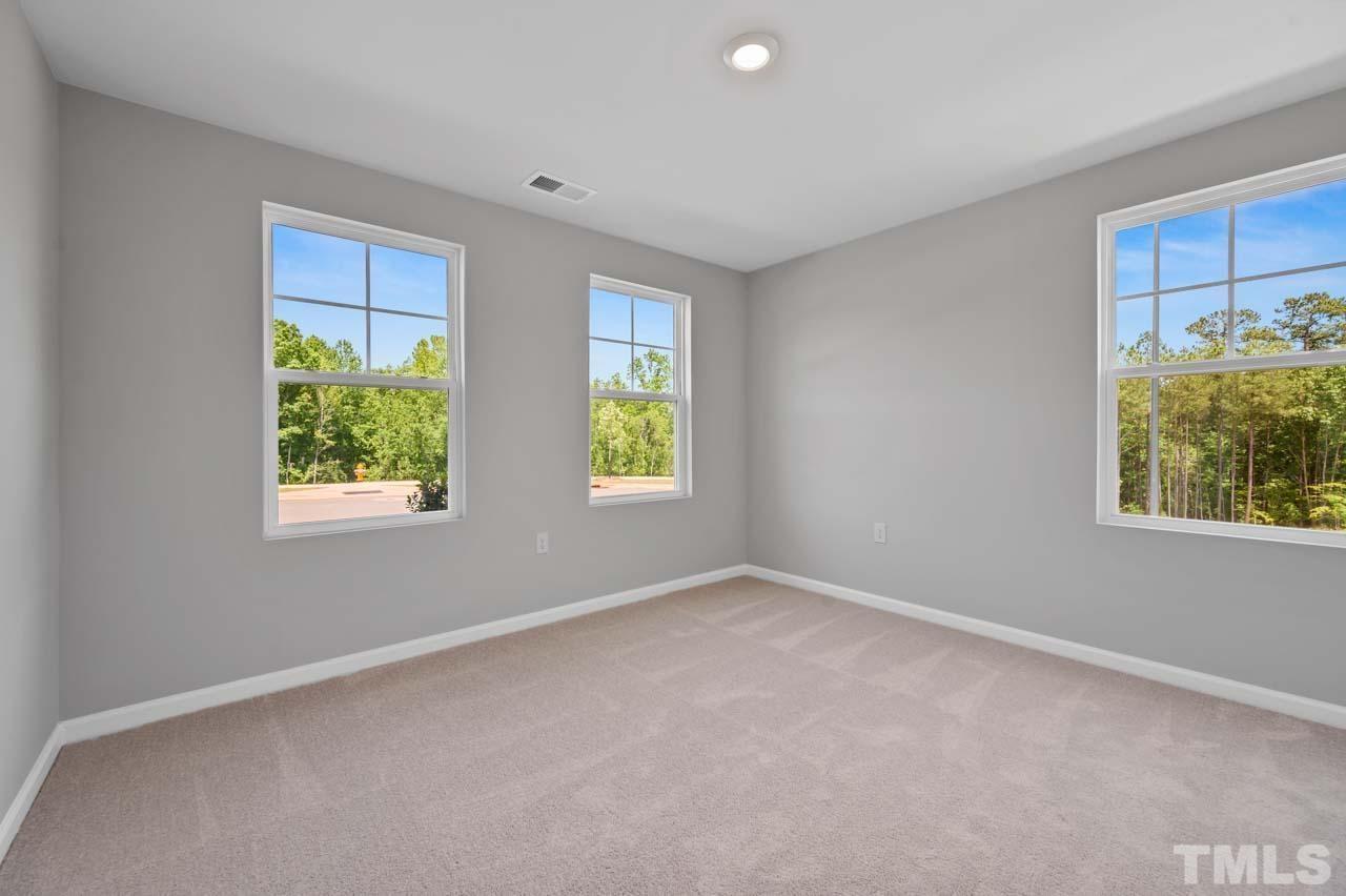 301 Devon Cliffs Drive Wake Forest, NC 27587 - Photo 14 of 26 a view of an empty room with a window
