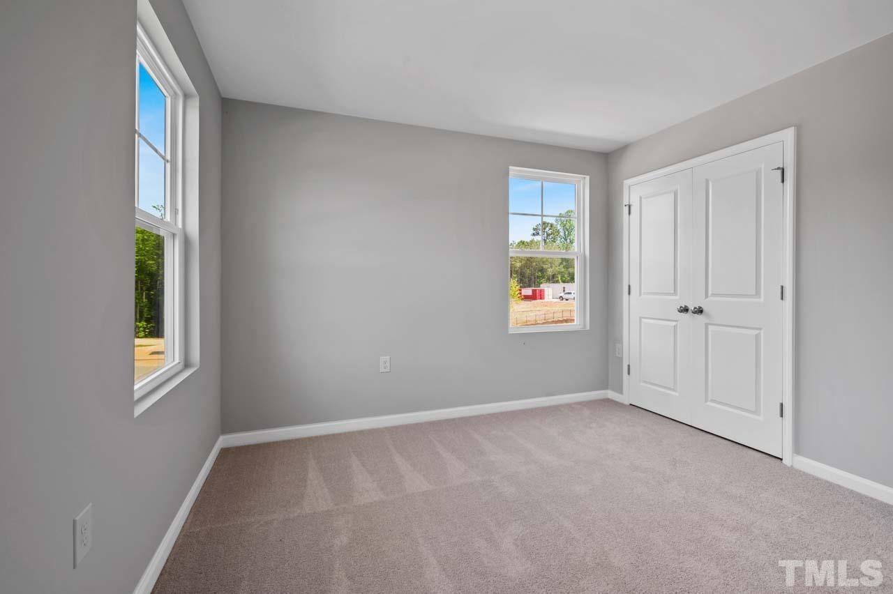 301 Devon Cliffs Drive Wake Forest, NC 27587 - Photo 15 of 26 an empty room with windows