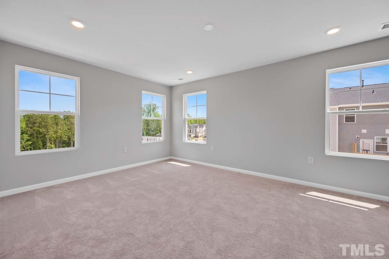 301 Devon Cliffs Drive Wake Forest, NC 27587 - Photo 17 of 26 a view of an empty room with a window