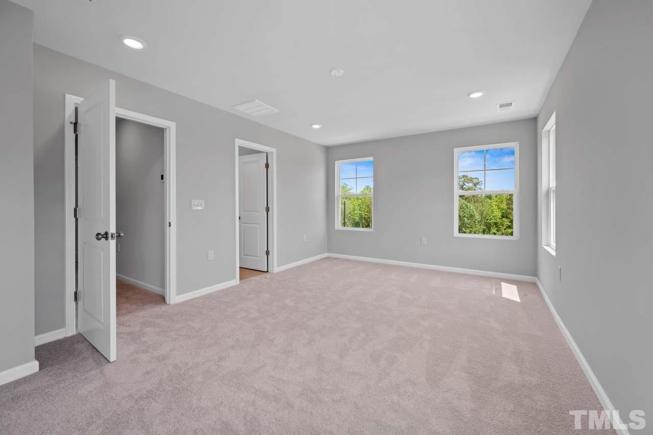 301 Devon Cliffs Drive Wake Forest, NC 27587 - Photo 19 of 26 an empty room with windows and closet