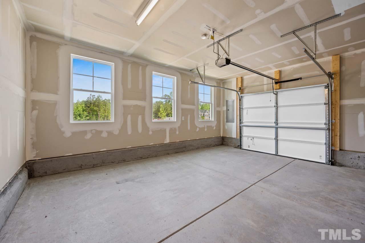 301 Devon Cliffs Drive Wake Forest, NC 27587 - Photo 23 of 26 a view of an empty room with windows