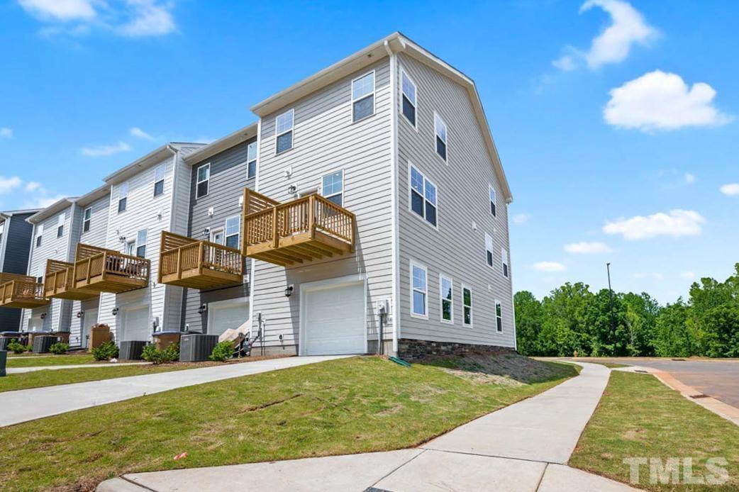 301 Devon Cliffs Drive Wake Forest, NC 27587 - Photo 24 of 26 a view of a house with a yard